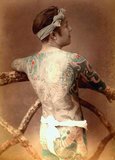 Irezumi (入れ墨, 入墨, 紋身, 刺花, 剳青, 黥 or 刺青) is a Japanese word that refers to the insertion of ink under the skin to leave a permanent, usually decorative mark; a form of tattooing.<br/><br/>

The word can be written in several ways, each with slightly different connotations. The most common way of writing irezumi is with the Chinese characters 入れ墨 or 入墨, literally meaning to 'insert ink'. The characters 紋身 (also pronounced bunshin) suggest 'decorating the body'. 剳青 is more esoteric, being written with the characters for 'stay' or 'remain' and 'blue' or 'green', and probably refers to the appearance of the main shading ink under the skin. 黥 (meaning 'tattooing') is rarely used, and the characters 刺青 combine the meanings 'pierce', 'stab', or 'prick', and 'blue' or 'green', referring to the traditional Japanese method of tattooing by hand.