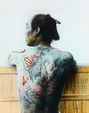 Irezumi (入れ墨, 入墨, 紋身, 刺花, 剳青, 黥 or 刺青) is a Japanese word that refers to the insertion of ink under the skin to leave a permanent, usually decorative mark; a form of tattooing.<br/><br/>

The word can be written in several ways, each with slightly different connotations. The most common way of writing irezumi is with the Chinese characters 入れ墨 or 入墨, literally meaning to 'insert ink'. The characters 紋身 (also pronounced bunshin) suggest 'decorating the body'. 剳青 is more esoteric, being written with the characters for 'stay' or 'remain' and 'blue' or 'green', and probably refers to the appearance of the main shading ink under the skin. 黥 (meaning 'tattooing') is rarely used, and the characters 刺青 combine the meanings 'pierce', 'stab', or 'prick', and 'blue' or 'green', referring to the traditional Japanese method of tattooing by hand.